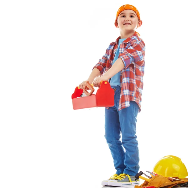 Kleiner Junge spielt Bauarbeiter. isoliert auf weiß — Stockfoto