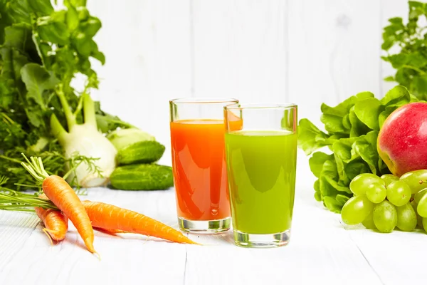 Carrot juice on white wood table — Stock Photo, Image