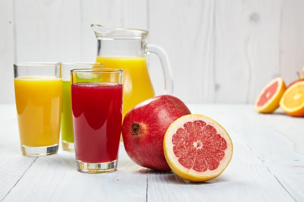 Glasses with fresh fruit juices — Stock Photo, Image