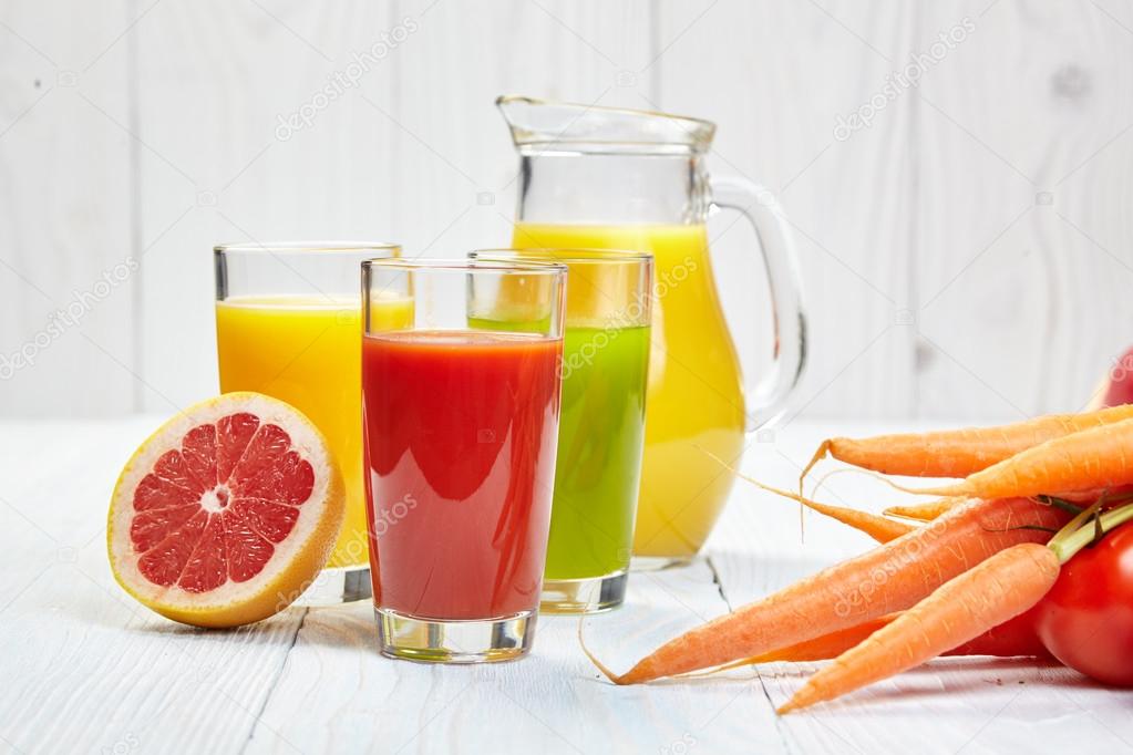 Glasses with fresh fruit juices