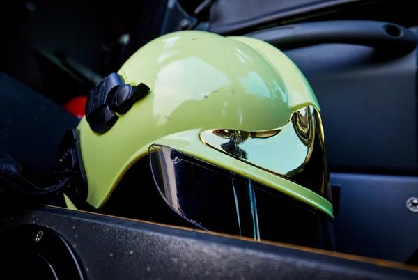 Fire helmet on car seat — Stock Photo, Image