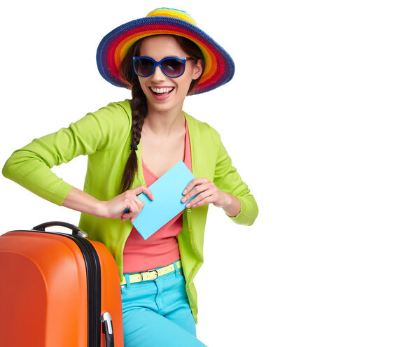 Tourist with travel suitcase and boarding pass