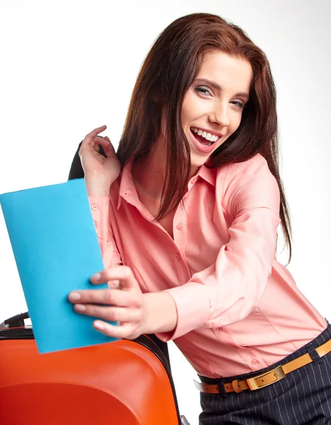 Businesswoman with a suitcase and a ticket — Stock Photo, Image