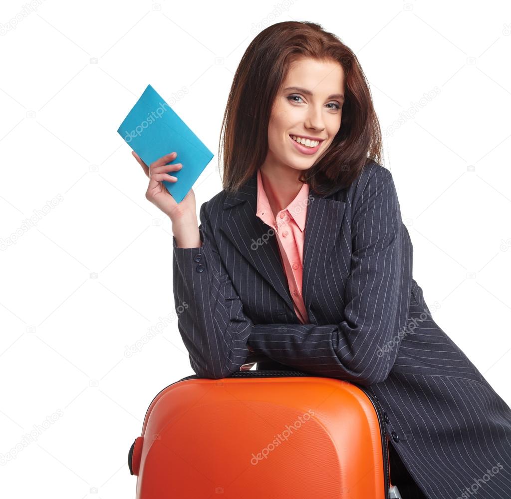 Businesswoman with a suitcase and a ticket