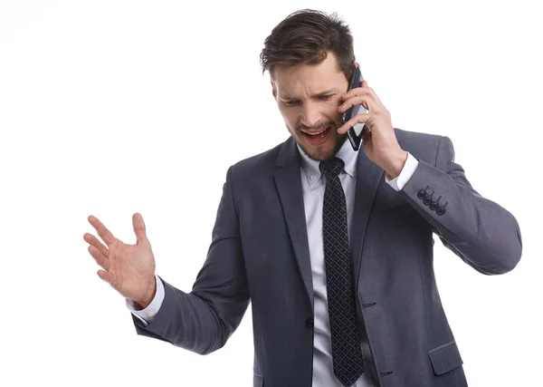 Empresario nervioso hablando por teléfono — Foto de Stock