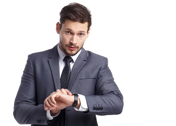 Young business man looking at watch — Stock Photo, Image