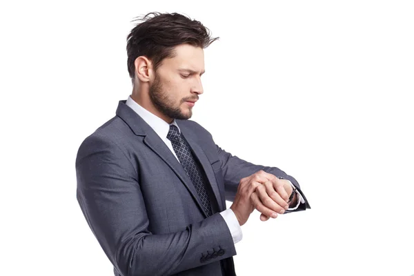 Young business man looking at watch — Stock Photo, Image