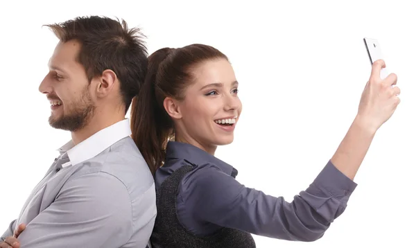 Attractive couple using smartphone — Stock Photo, Image