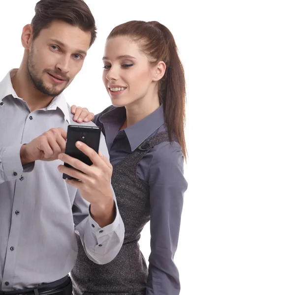 Attractive couple using smartphone — Stock Photo, Image