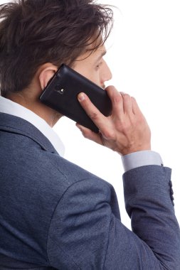 cep telefonuyla konuşan işadamı