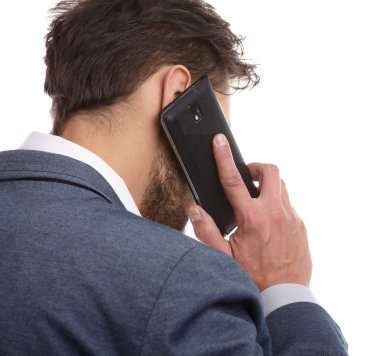 cep telefonuyla konuşan işadamı