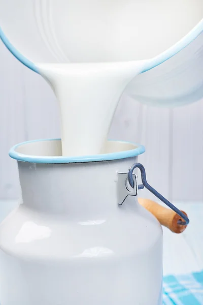 Pour milk into container