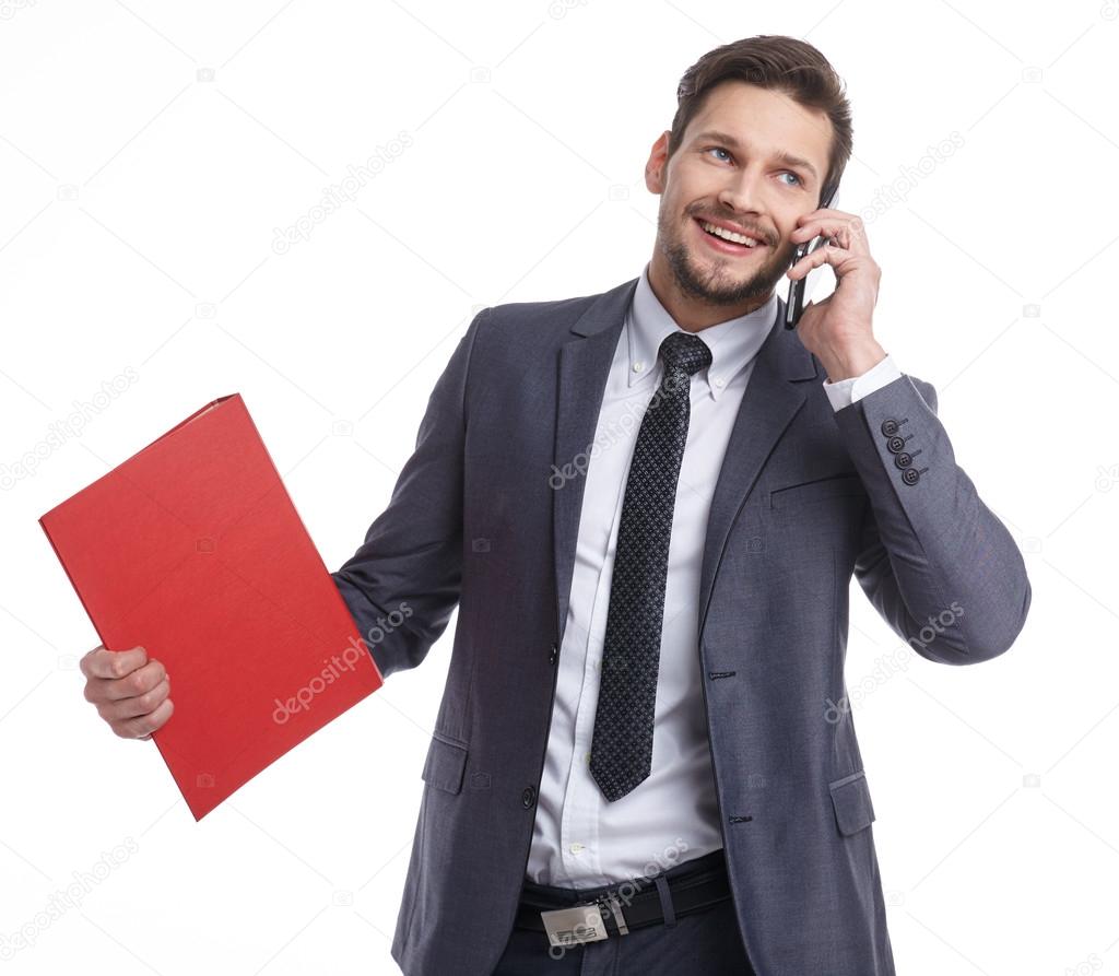businessman with phone and folders