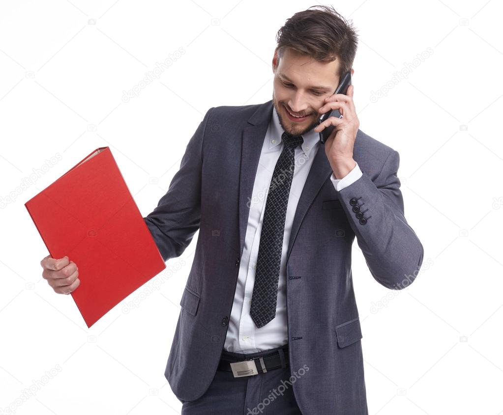 businessman with phone and folders