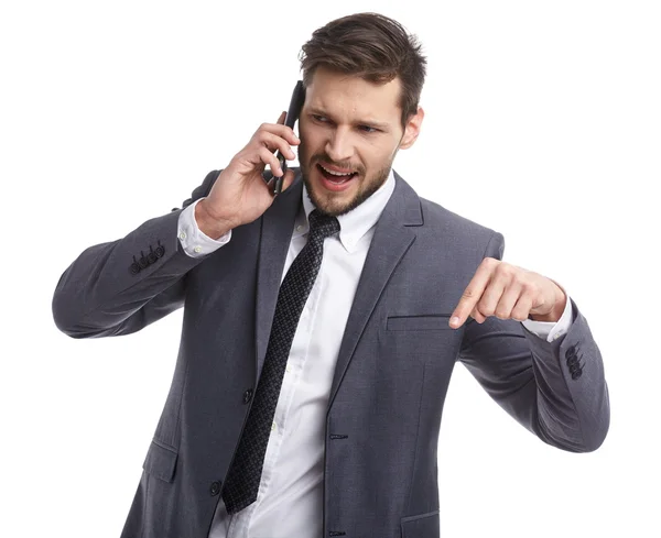 Hombre de negocios en traje hablando por teléfono — Foto de Stock