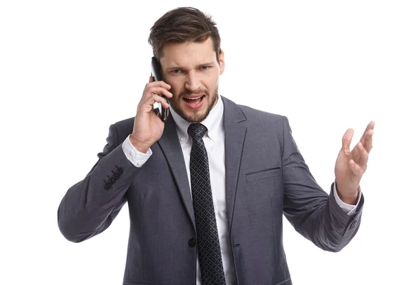 Businessman in suit talking on phone — Stock Photo, Image