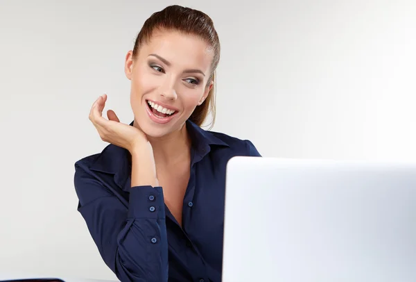 Woman with a laptop at office — Stock Photo, Image