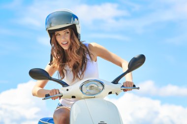 happy woman on a scooter