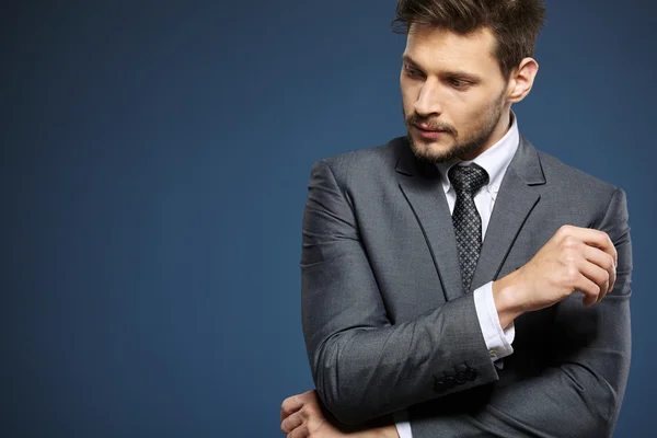 Handsome young businessman standing — Stock Photo, Image