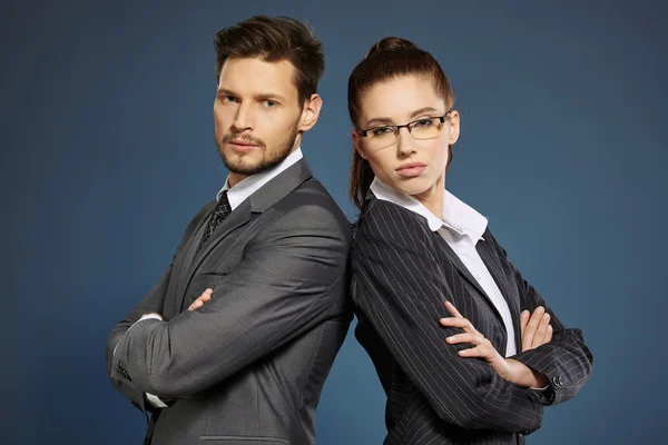 Business couple in suits — Stock Photo, Image