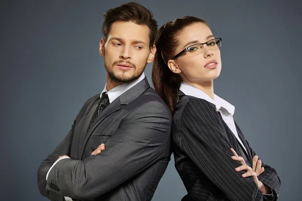 Business couple in suits — Stock Photo, Image