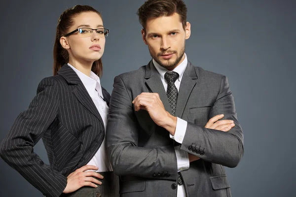 Business couple in suits — Stock Photo, Image