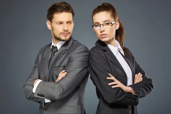 Business couple in suits — Stock Photo, Image