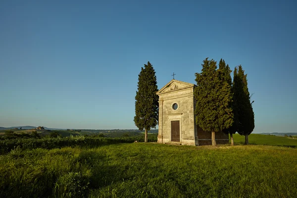 Chapel surrounded by cypress trees — Stock Photo, Image