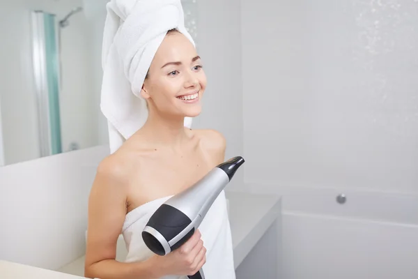 Woman wrapped in white towel — Stock Photo, Image