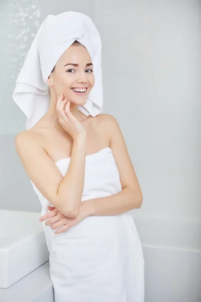 Woman wrapped in white towels — Stock Photo, Image