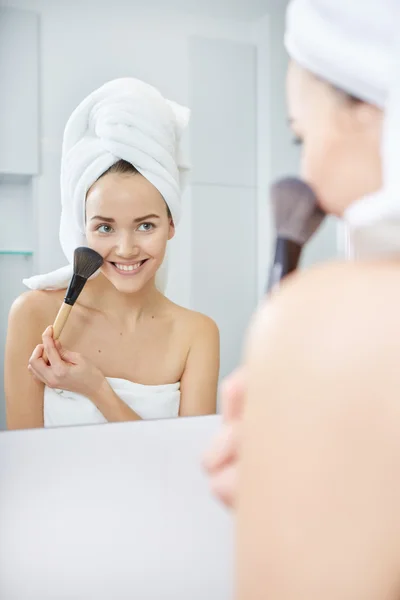 Woman wrapped in white towels — Stock Photo, Image