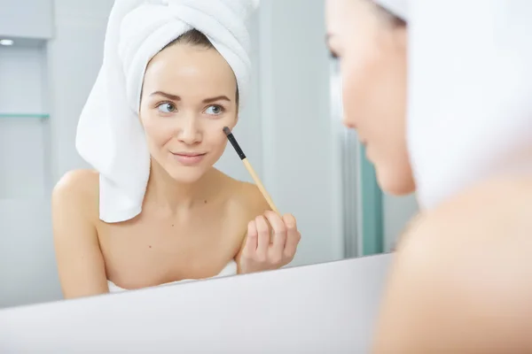 Woman wrapped in white towels — Stock Photo, Image