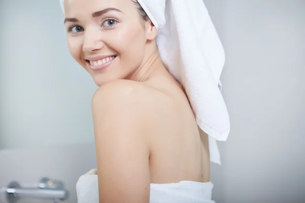 Woman wrapped in white towels — Stock Photo, Image