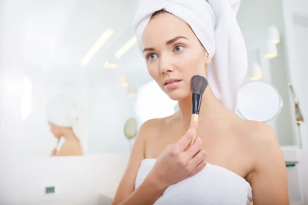 Woman wrapped in white towels — Stock Photo, Image