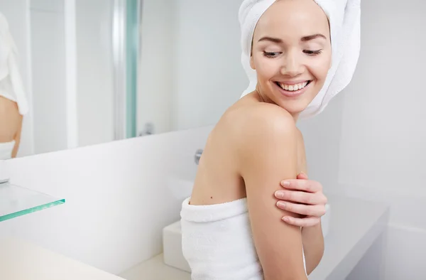 Woman wrapped in white towels — Stock Photo, Image