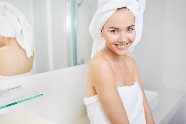 Woman wrapped in white towels — Stock Photo, Image