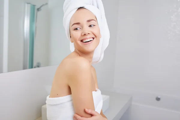 Woman wrapped in white towels — Stock Photo, Image