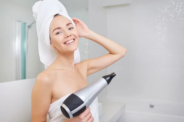 Woman wrapped in white towel — Stock Photo, Image