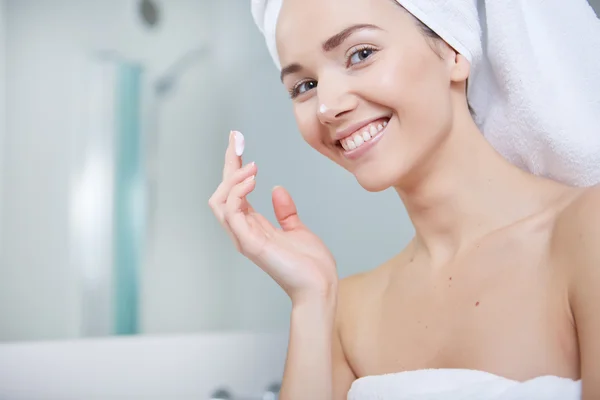 Woman wrapped in white towels — Stock Photo, Image