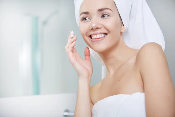 Woman wrapped in white towels — Stock Photo, Image