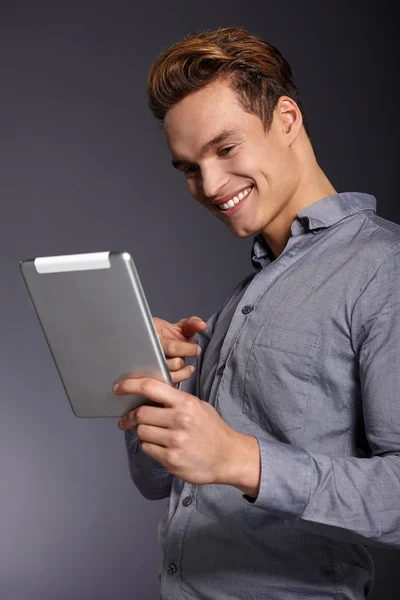 Young man with tablet — Stock Photo, Image