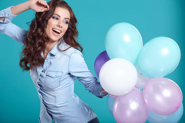 Brunette woman with balloons — Stock Photo, Image
