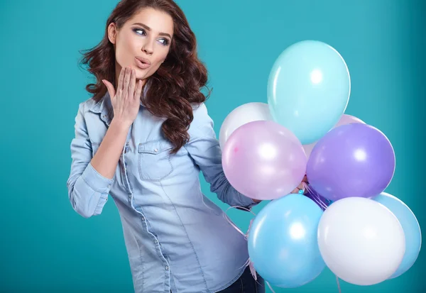 Brunette woman with balloons — Stock Photo, Image