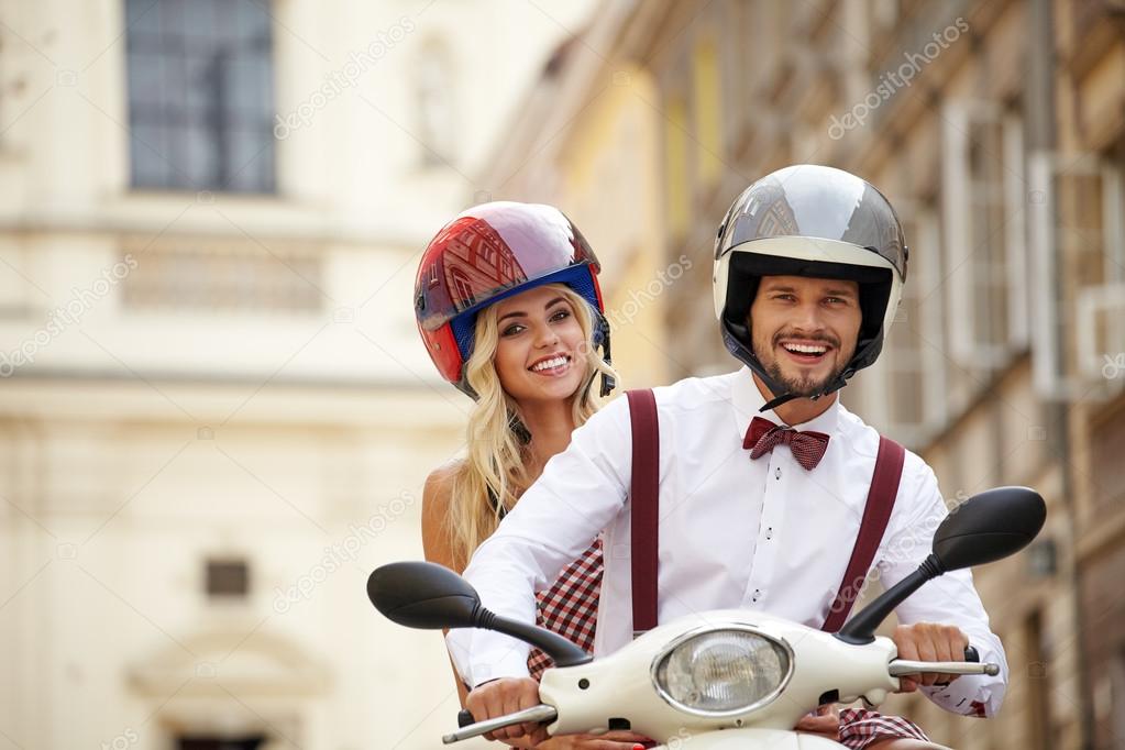 hipsters couple on scooter