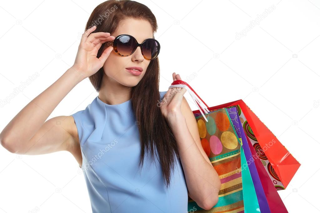 Woman with shopping bags over white