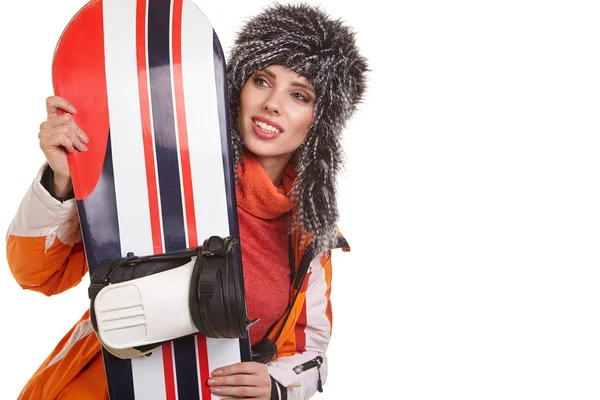 Woman standing with snowboard Stock Photo