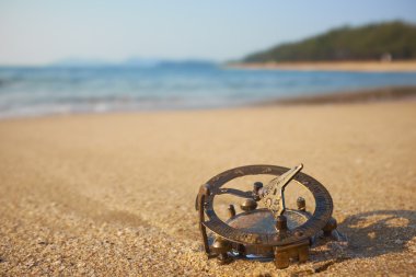 beach with vintage sundial clipart