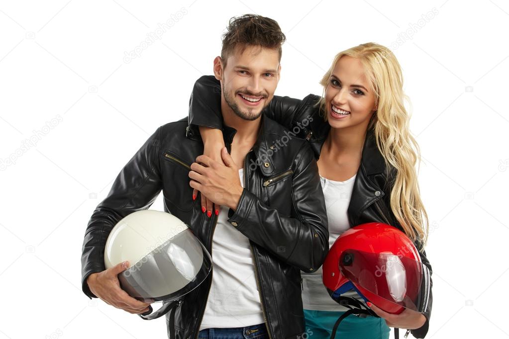 motorcyclists couple with helmets