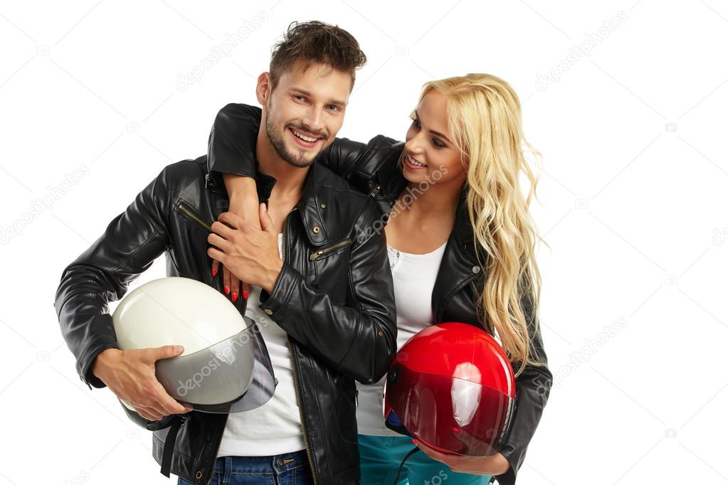 motorcyclists couple with helmets