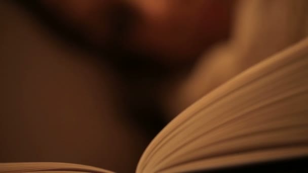 Tired young woman reading a book — Stock Video